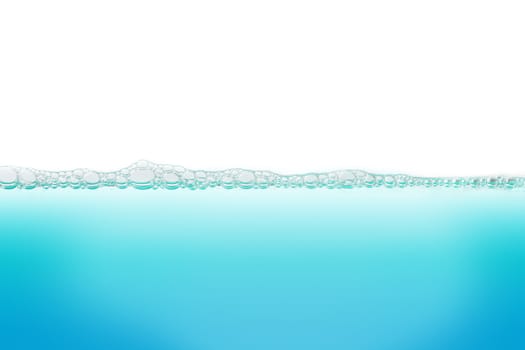 Water with bubbles of air, green and blue clean fresh white background 