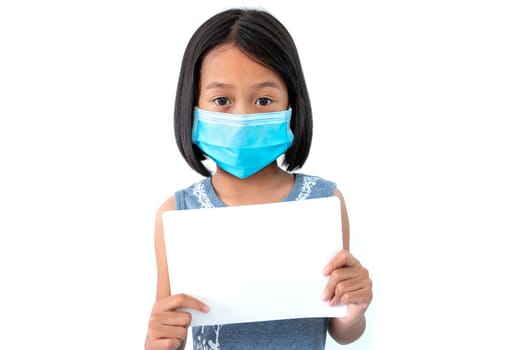 Asian little girls wearing masks to prevent the spread of the coronavirus (COVID-19) with a blank white paper on white background.