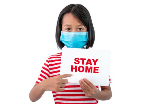 Coronavirus (COVID-19) concept, The girl wearing a mask holding a paper with a message "STAY HOME" to encourage everyone to work together at home.