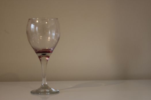 Alcohol/wine empty glass on white stock.