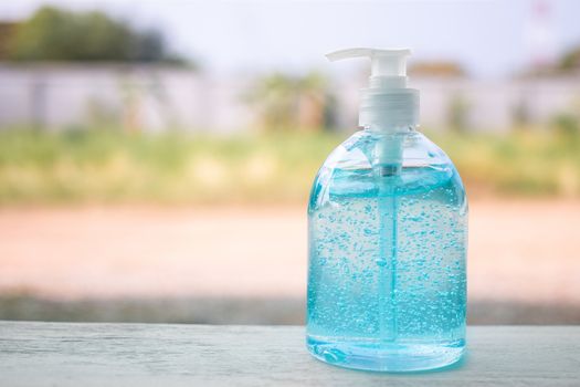 Plastic bottle pump with alcohol hand gel. Hand Sanitizer Antibacterial Cleansing Gel