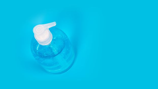 Alcohol gel Sanitizer hand gel cleaners for anti Bacteria and virus on Blue Background, People using alcohol gel to wash hands to prevent Coronavirus (COVID-19)