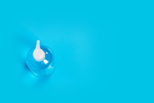 Alcohol gel Sanitizer hand gel cleaners for anti Bacteria and virus on Blue Background, People using alcohol gel to wash hands to prevent Coronavirus (COVID-19)