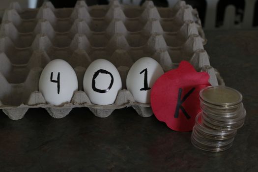 The word 401k wrote on eggs. Theme of nest egg for retirement.