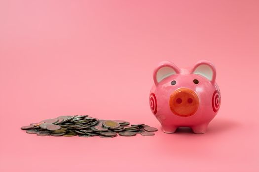 Pink piggy bank on pastel pink background, Financial concepts