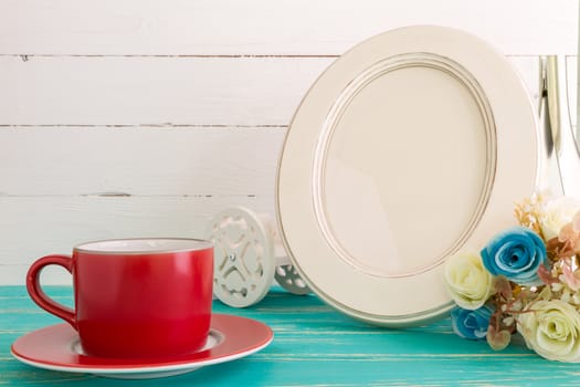 White vintage photo frame on table with decoration background.