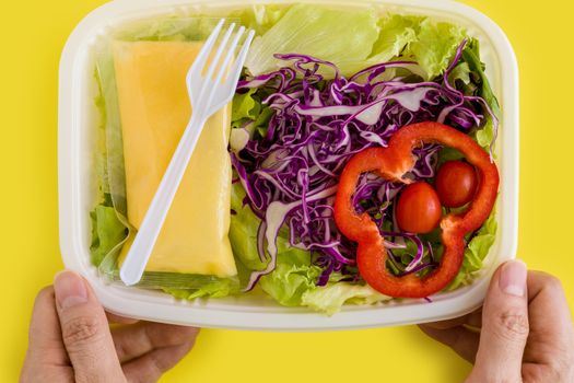 Fresh salad in plastic box ready for takeaway.