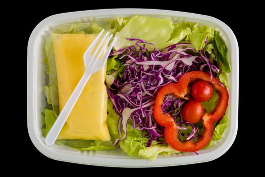 Fresh salad in plastic box ready for takeaway.