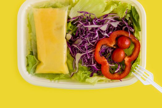 Fresh salad in plastic box ready for takeaway.