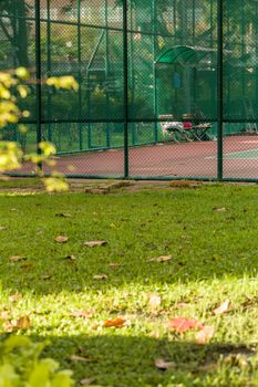 Quite and calm scene of public tennis court.