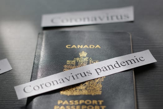 Canadian passport next to caronavirus headline