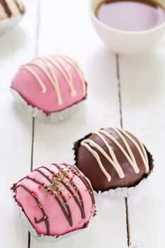 Colorful donuts with cup of coffee for relaxing moment.