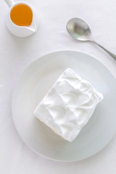 White cake for tea break moment on white background.