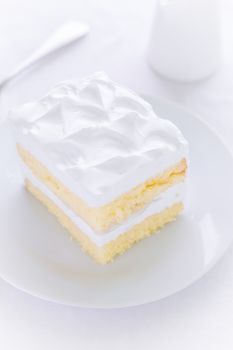 White cake for tea break moment on white background.