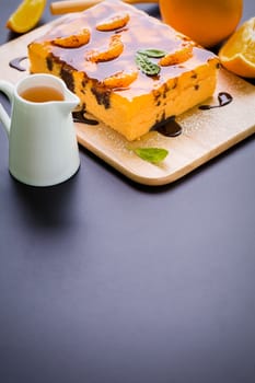 Orange cake with chocolate sauce for tea break.