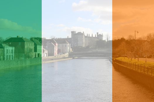 Irish flag composite over the historic city of Kilkenny Ireland .