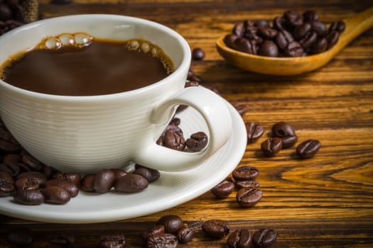 Warm coffee in white cup for relaxing moment.