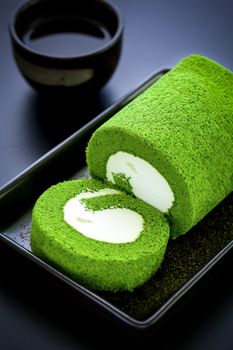 Green tea cake with tea cup for relaxing time.