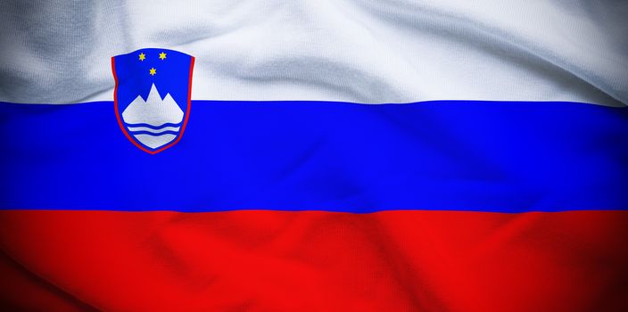 Wavy and rippled national flag of Slovenia background.