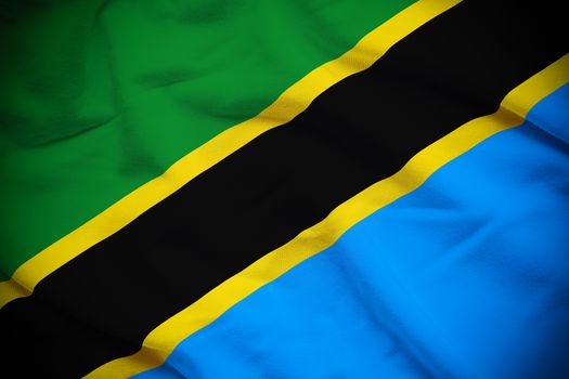 Wavy and rippled national flag of Tanzania background.