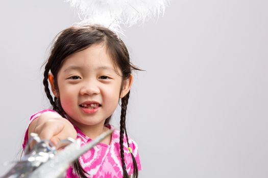 Young girl in fairy costume on isolated white background.