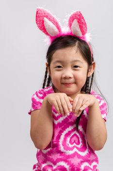 Child wearing bunny ears illustrating Easter concept.