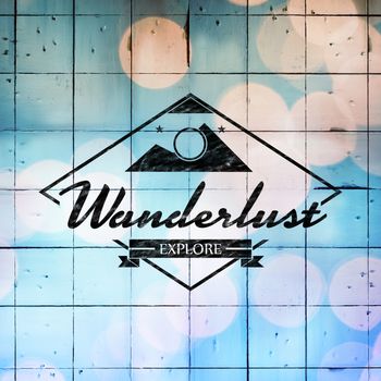Wanderlust logo against wooden planks