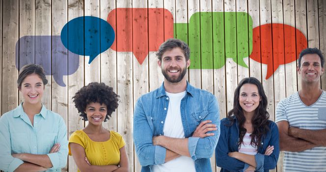 Group portrait of happy young colleagues  against wooden planks background