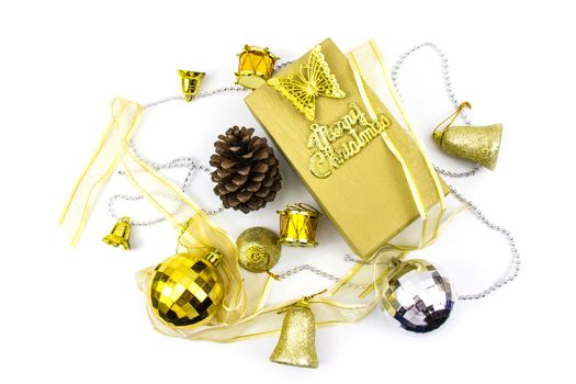 Christmas golden and silver decorations on white background. Greeting card on gift box.
