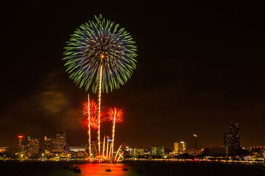 Firework colorful on night city view background for celebration festival.