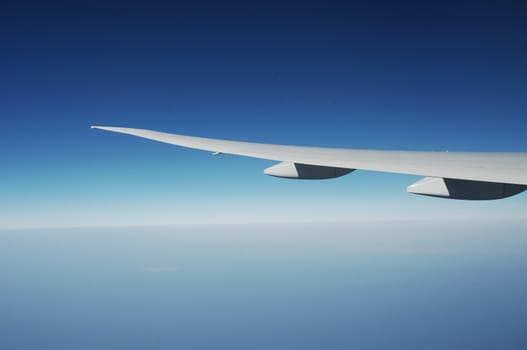 Aerial view of Clouds through flight window