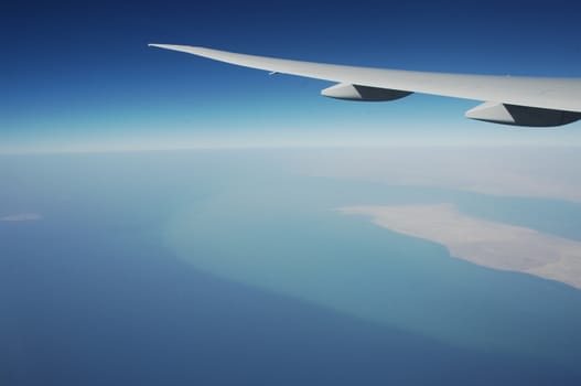 Aerial view of Clouds through flight window