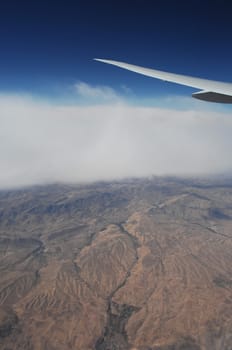 Aerial view of Clouds through flight window