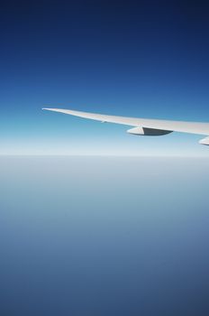 Aerial view of Clouds through flight window