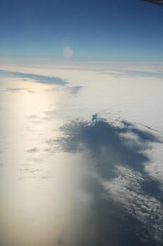 Aerial view of Clouds through flight window