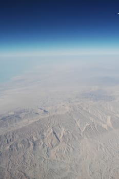 Aerial view of Clouds through flight window