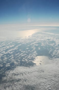 Aerial view of Clouds through flight window