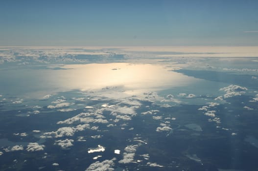 Aerial view of Clouds through flight window
