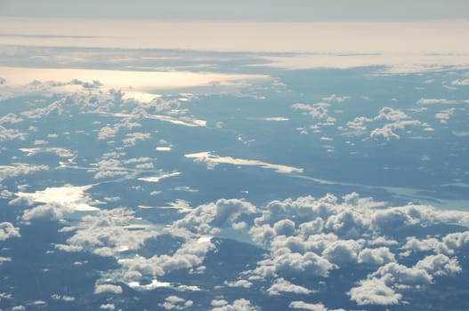 Aerial view of Clouds through flight window