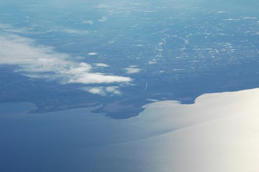 Aerial view of Clouds through flight window
