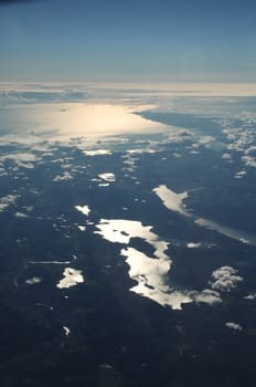 Aerial view of Clouds through flight window