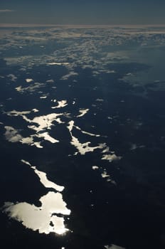 Aerial view of Clouds through flight window