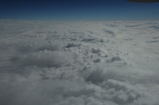 Aerial view of Clouds through flight window
