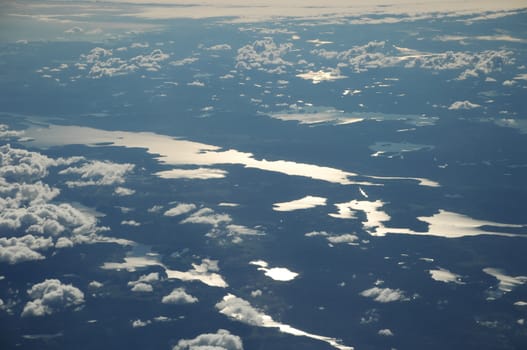 Aerial view of Clouds through flight window