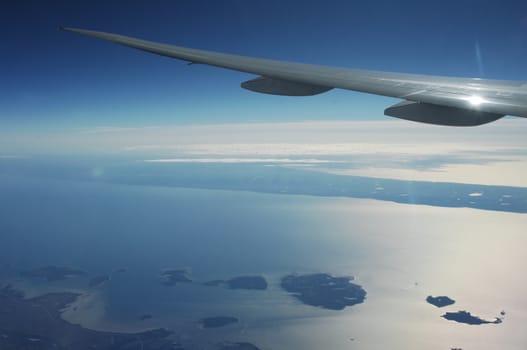Aerial view of Clouds through flight window