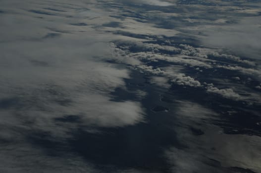 Aerial view of Clouds through flight window