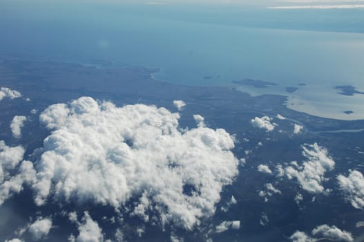 Aerial view of Clouds through flight window