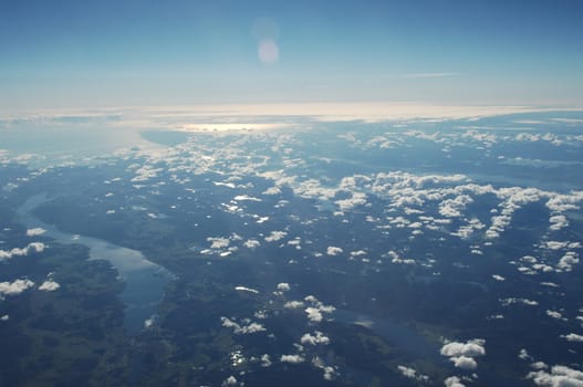 Aerial view of Clouds through flight window