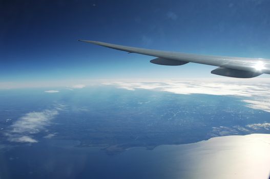 Aerial view of Clouds through flight window