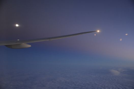 Aerial view of Clouds through flight window